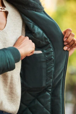 Green Faux Fur Hooded Parka With Gold Zip Pockets -Sosandar Fashion Store web 103 a22tk530nl0003 s22bd010be0010 a22ow003gn0050 252