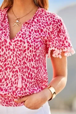Pink & White Animal Print Pom Pom Top 11 Pink & White Animal Print Pom Pom Top -Sosandar Fashion Store web 2503 60 setow025pk0020 s25bd018we0001 60 171 rt